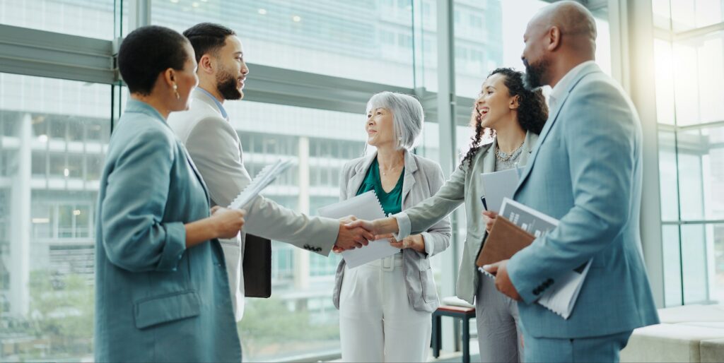 Business people, handshake and meeting in b2b, deal or agreement for teamwork or growth at office.