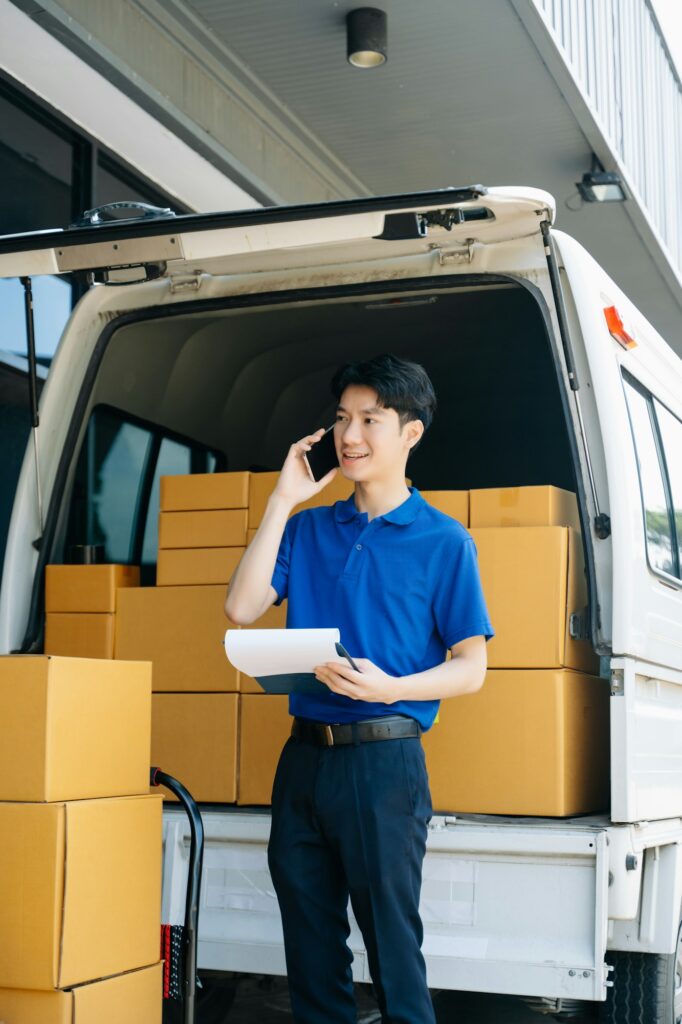 Portrait of courier delivery man searching the address on digital tablet. Delivery service,